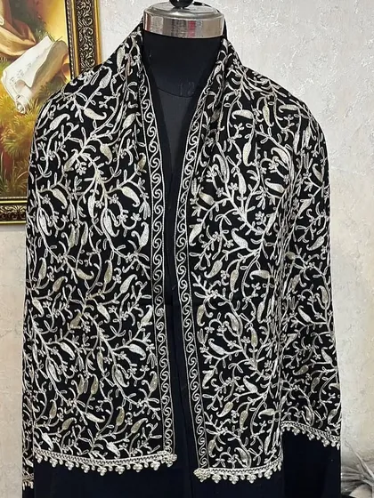 This black velvet pashmina with silver floral embroidery is incredibly luxurious. It's a real statement piece that feels as good as it looks.