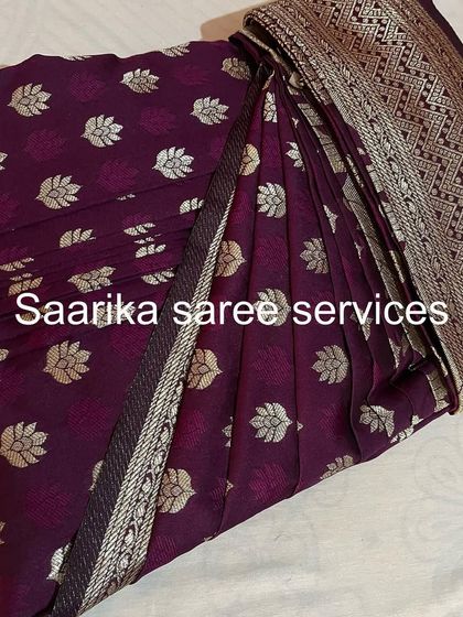 A lovely purple saree with silver butis, pleated and ready. This service is perfect for getting your festive wardrobe in order.