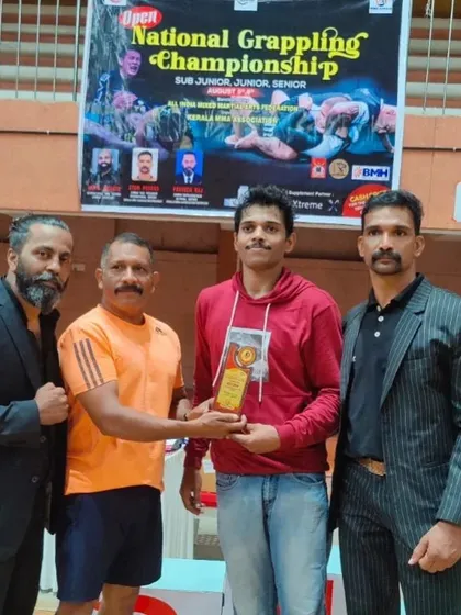 Receiving a trophy at the national grappling championship. Every win is a team win because we all push each other in the gym.