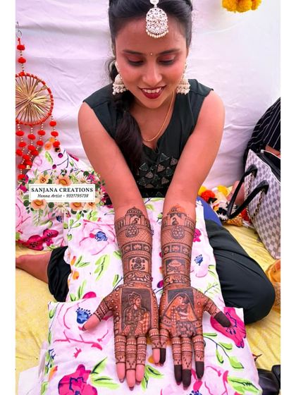 The bride admiring her detailed mehndi. It’s a piece of art she gets to wear for the most important day of her life.