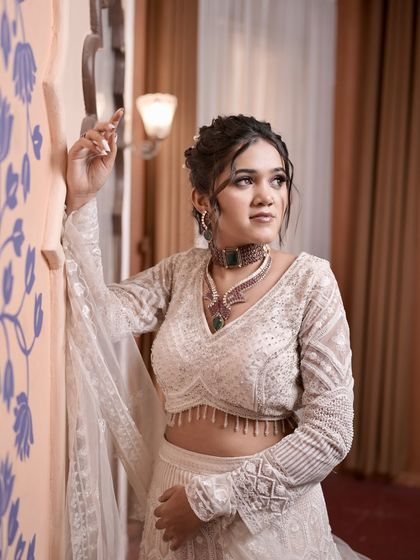 A candid-style shot of the model. The hairstyle looks effortless and romantic, making it a great choice for a pre-wedding photoshoot or engagement party.