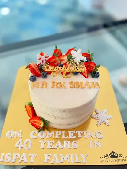 A corporate milestone cake celebrating 40 years of service. This fresh fruit cake is personalized with a congratulatory message.