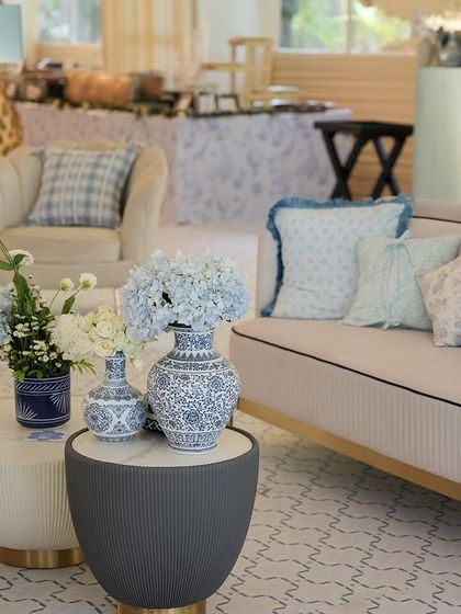 Another view of the sophisticated lounge seating, with blue and white chinoiserie-style vases.