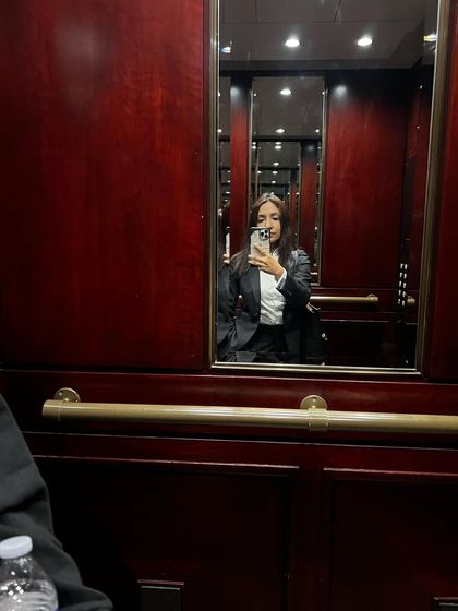 An elevator selfie reflecting on a sense of accomplishment after a long and challenging day. The life of a lawyer, especially one handling international cases, involves many silent battles. It's about having the himmat to keep going, choosing your battles wisely, and being your own biggest supporter.