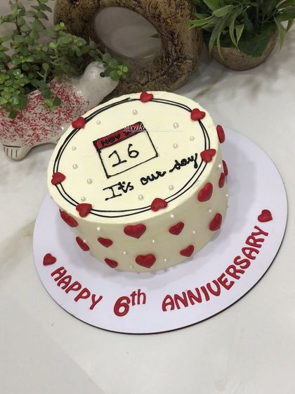 A beautiful way to mark your special day. This anniversary cake features a hand-drawn calendar with the significant date circled, surrounded by red hearts. A sweet and personal design.