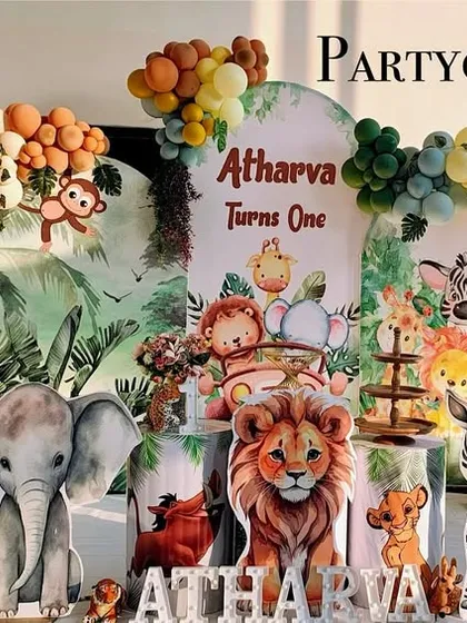 A retro-colored jungle theme for a first birthday. The use of muted oranges, yellows, and greens gives a stylish twist to the classic safari party.