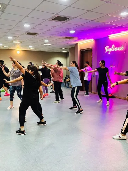 A snapshot of the whole class learning a new move together. We break down the steps so everyone can follow along and feel successful.