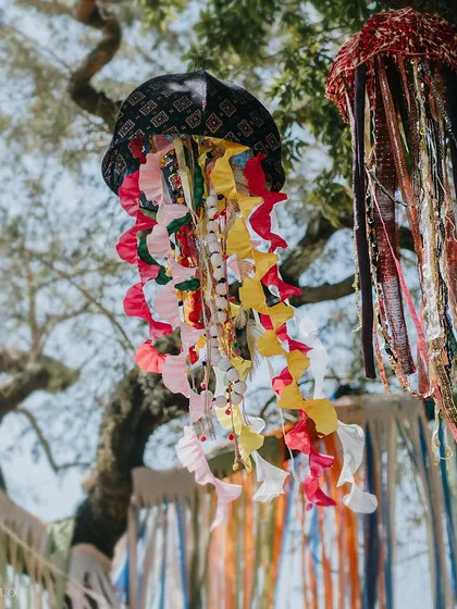Colorful, handmade jellyfish hang from the trees, their ribbon tentacles dancing in the breeze. This whimsical detail added to the magical, underwater-meets-festival theme.