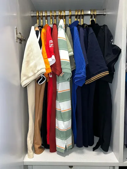 Even a simple t-shirt collection can look elevated when hung and organized by color on matching hangers.