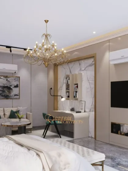 This master suite includes a TV unit, a study desk, and ample wardrobe space, all designed with a cohesive aesthetic of neutral tones and marble accents.