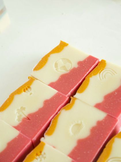 The vibrant, natural colors of the 'Herbal Revival' soap come from botanicals and clays.