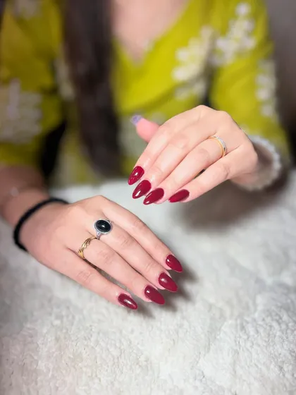 A classic, glossy deep red manicure. A perfect application of a classic color is a skill that never goes out of style.