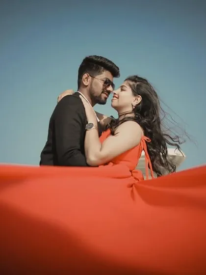 A creative close-up shot, with the red fabric of the gown filling the foreground. This is a great way to add an artistic touch to your pre-wedding album.