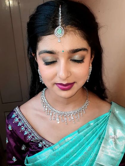 A close-up of the makeup for a house function. I created a beautiful green and silver smokey eye to match her diamond jewelry and turquoise saree.