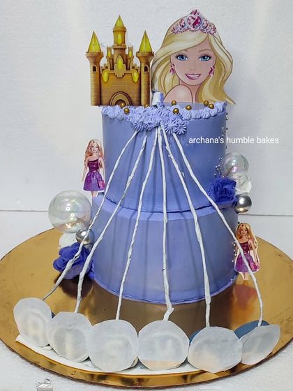 A unique Barbie-themed fire cake, where the top layer burns away to reveal a surprise.