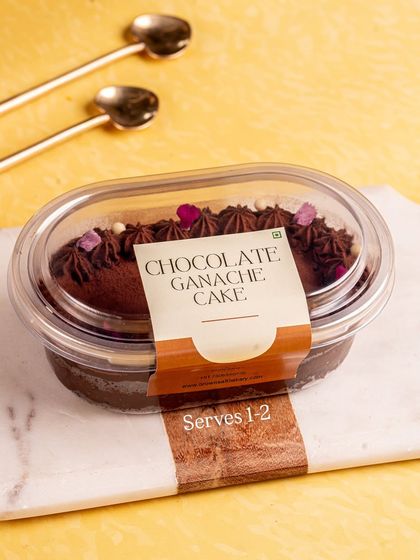 Our Chocolate Ganache cake tub, labeled and ready for same-day delivery. A perfect fix for any chocolate craving.