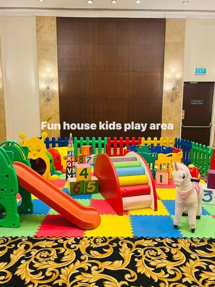 A closer look at the climbing and sliding elements within the colorful, soft-matted play zone.