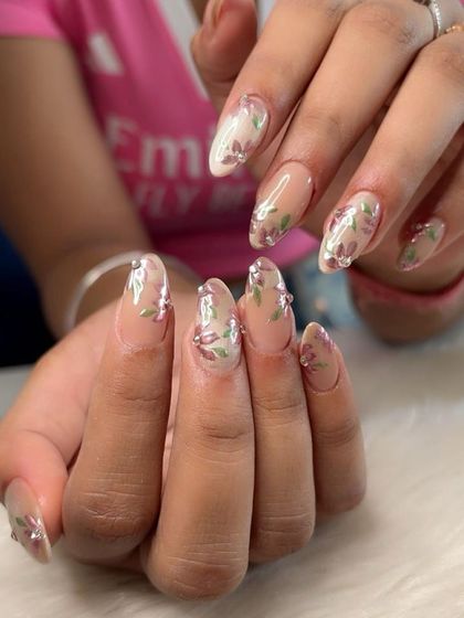 Another angle of the chrome art on silver cat eye nails, showing the floral pattern.