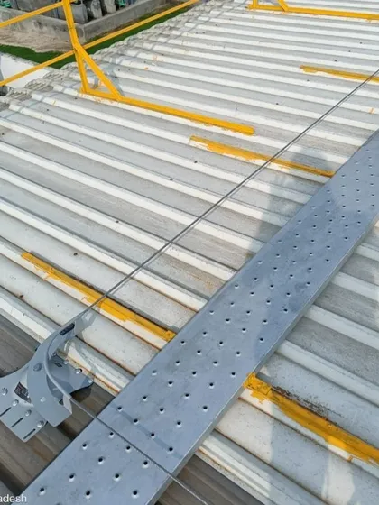 A detailed view of the safety lifeline and walkway system on a metal roof. This is a critical component of our installations, ensuring that future maintenance and inspections can be carried out safely and efficiently.