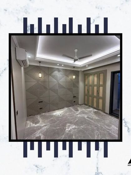 This bedroom features a unique, geometrically patterned feature wall that also serves as a headboard and storage unit. The grey marble flooring adds another layer of texture and luxury.