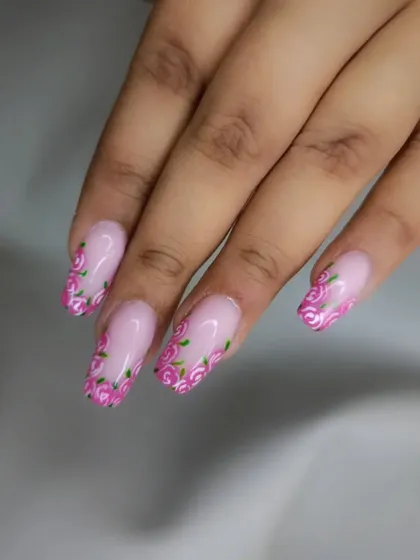 A similar floral French tip design on square-shaped nails.