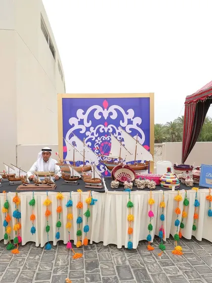 A "souk" or marketplace stall at the Moroccan-themed event, featuring local crafts and treats, creating an immersive cultural experience for guests.