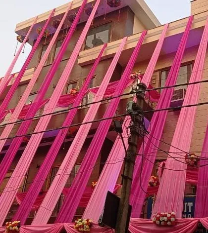 A modern house decorated with bright pink drapes for a wedding event. I can create contemporary looks using fabric and flowers to match the style of your home.
