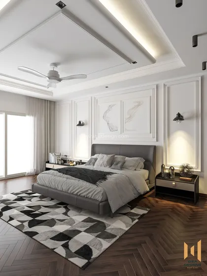 Your bedroom should be your personal sanctuary. In this modern classic master bedroom at Raheja Viverea, we blended a luxurious black and white palette with rich brown accents and herringbone flooring. The design features classic wall mouldings and a sleek, mirrored wardrobe to create a space that is both timeless and sophisticated.