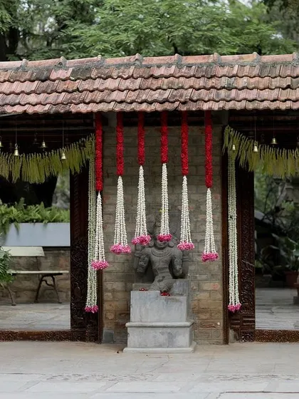 The entrance to the courtyard, decorated with beautiful floral curtains, creating a grand and festive welcome.