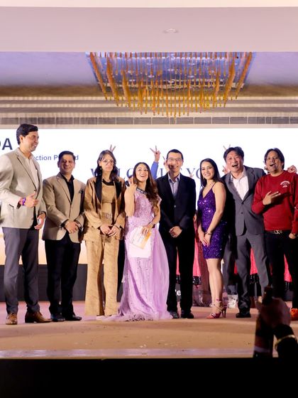 Celebrating with the entire team on stage. A great event is always a collaborative effort, and I make sure to acknowledge everyone who made it happen.