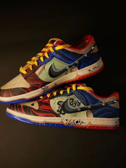 This Harley Quinn inspired Nike Dunk was one of the most challenging and rewarding pairs I've ever made. It's packed with details from her tattoos and outfit, including punk-style spikes. This is for anyone who loves a bold, gothic vibe.