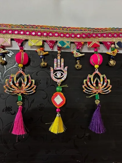 This 'Shubh Toran' with its lotus and hamsa symbols has found a new home. The combination of tassels, beads, and little birds brought so much positive energy to this piece.