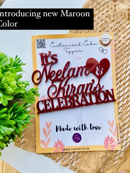 A promotional shot announcing the new Maroon color, featuring the "It's Neelam & Kiran's Celebration" topper.