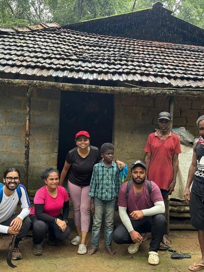 A group photo with our local hosts outside their simple, traditional house. Connecting with the local people is a key part of our journeys.