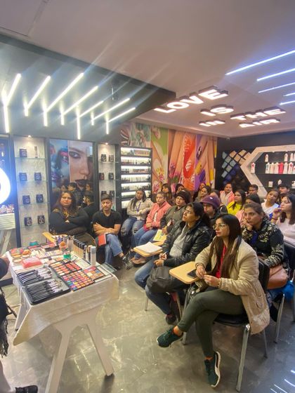Another view of our students engaged in a makeup workshop. We maintain small batch sizes to ensure every student gets personalized attention from the instructors.