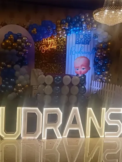 A closer look at the Rudransh's Boss Baby stage setup. The combination of the lit-up letters and the detailed backdrop creates a fantastic focal point for the party.