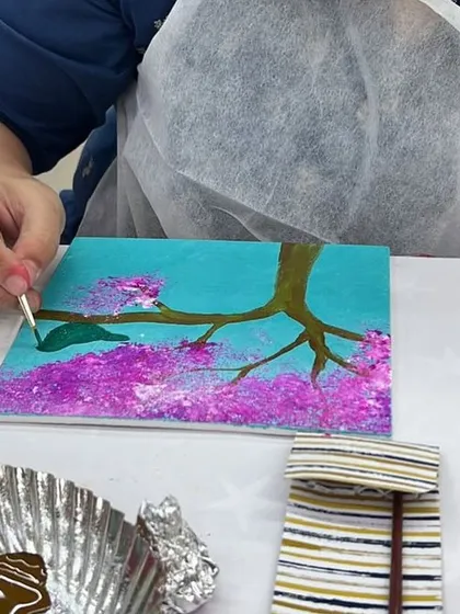 Feel the brush in your hand and watch the colors come to life. This is a close up from our cherry blossom painting session, where we guide you through each step to create a beautiful piece of art. It's a therapeutic experience, perfect for unwinding and focusing your creativity.