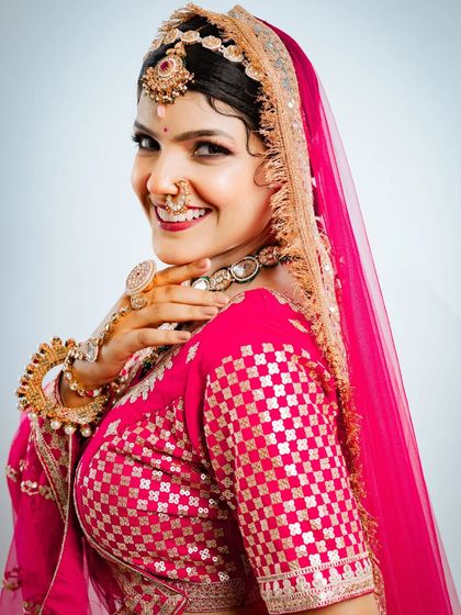 A radiant smile completes the look. This close up shows the beautiful makeup and the sparkle of the jewellery.