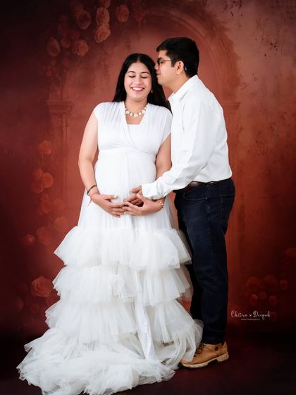 A sweet and candid moment filled with laughter. We love capturing the genuine joy between couples during their maternity session.