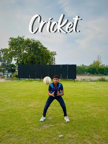 Eyes on the ball. A young fielder positions himself perfectly to take a catch, showing great concentration.