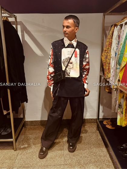 Sanjay Dauhalia unveils a new dimension of style in our Matrix Set. The holographic pullover and box-pleated trousers make for a striking, futuristic look.