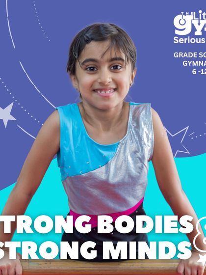 Confidence shines through as this grade schooler poses on the balance beam. Our classes help children develop not just physical balance, but also the mental poise to perform with self-assurance.