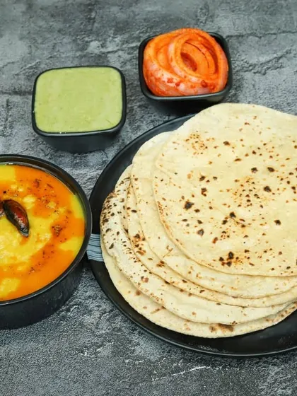 For those who love the classics, here is a simple and comforting meal of Dal Tadka with a stack of my soft, home-style tawa rotis. It's the ultimate comfort food.