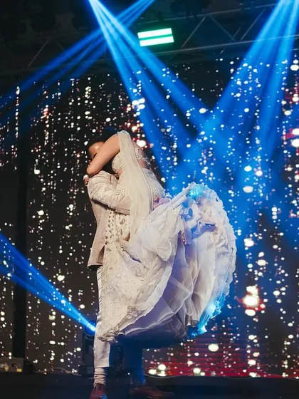 That perfect lift, the stunning lights, the movie-like moment. This is the kind of iconic shot we aim to create for your couple's performance, a memory you'll cherish forever from your Roka night in Mumbai.