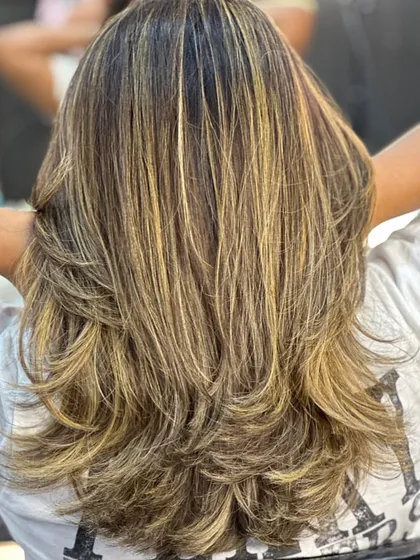 This is one of my most requested looks: a combination of a layered haircut with expertly blended global highlights. It creates a sun-kissed, dimensional effect that looks effortlessly gorgeous.