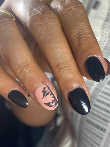 The contrast between the black polish and the delicate line art is stunning.