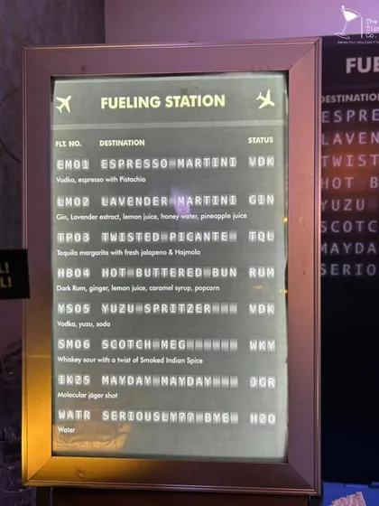 Your menu should tell a story. For this travel-themed event, we designed the cocktail list as an airport departure board, with each drink listed as a "destination" and its spirit as the "status".