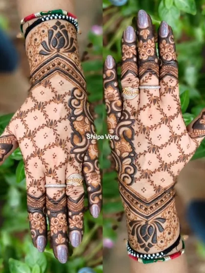 A beautiful 'jaal' or net design that creates a delicate lace-glove effect on the hands.
