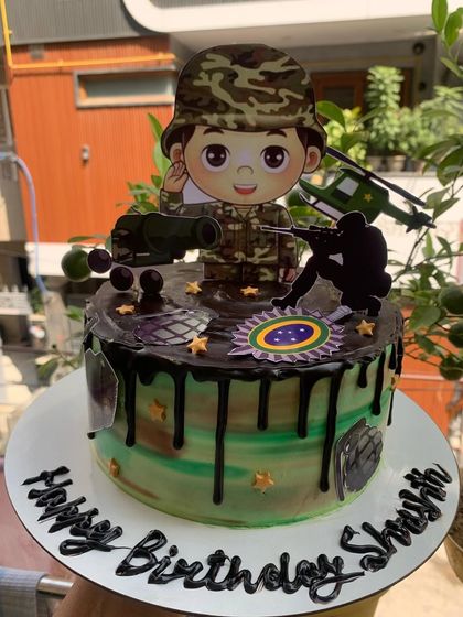 A detailed army-themed cake, perfect for celebrating a patriot or a fan of military action.
