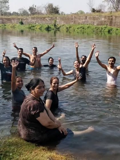 Our community enjoying a refreshing dip in the river during our Holi celebration, washing away the old and welcoming the new.
